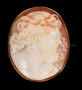 An Antique 14K Gold Cameo: Carved from shell and with a 14k yellow gold frame. A portrait of Jesus Christ. Dimensions:2 1/6" x 1 3/4", the total approximate weight is 11.44 dwt. Provenance:From a NJ collection.