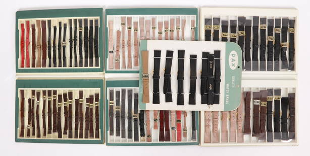 A Large Group of New Old Stock Watch Bands: Comprising, twenty four genuine lizard bands, a cardboard display with seven black Dax brand bands, and fifty eight genuine lizard bands for ladies watches by Simo. Dimensions:Various, the holders