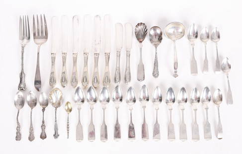 A Group of Sterling and Coin Silver Flatware: From the mid 19th century to the early 20th century, various forms and makers. Dimensions:From 6" to 9 1/4" long. The total approximate weight of the all silver pieces is 23 troy ounces. 