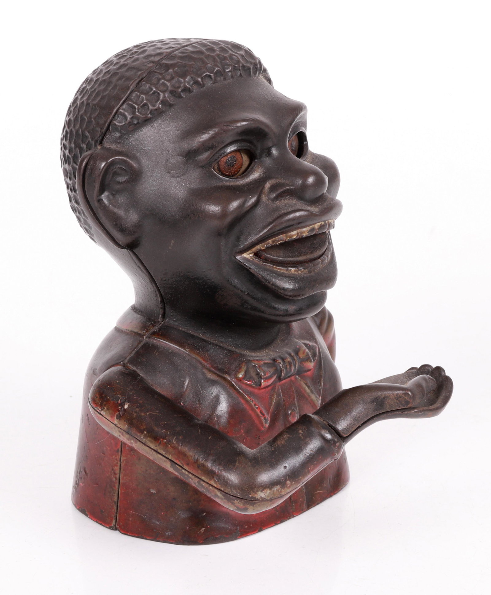 Black Americana Mechanical Jolly Bank: Manufactured by the J. & E. Stevens Co., Cromwell, Conn. Painted cast iron, late 19th Century. Dimensions:6.5" H x 5.5" W x 5.5" D Provenance: