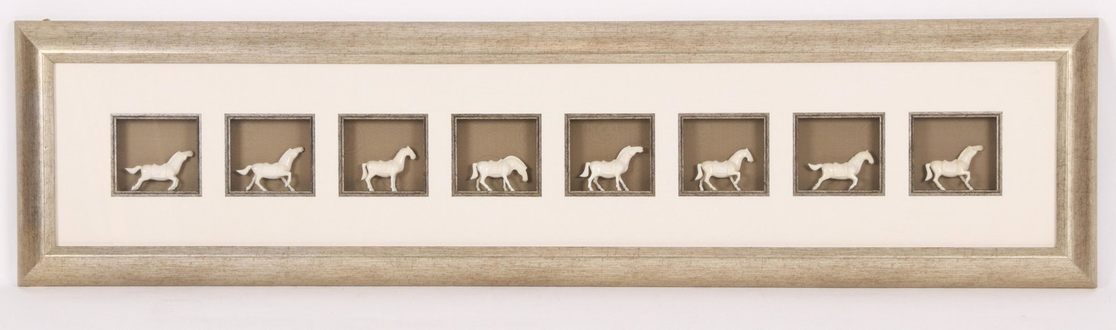 Framed Collection Of Carved Bone Horse Figures: 20th century, eight Tang Dynasty style carved bone horses, each in a different posture, mounted in a modern shadow box frame. Dimensions:Each horse measures about 4" L; the frame measures 16" H x 61" 