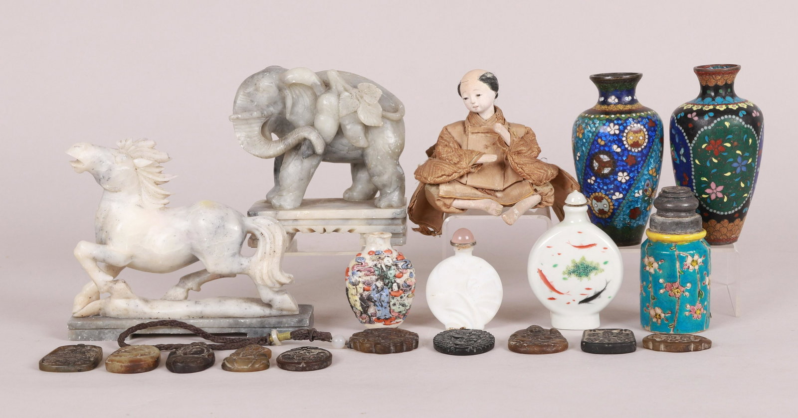 Estate Group of Chinese Snuff Bottles, Etc.: To include 13 carved hardstone charms, a carved quartz horse, a carved quartz elephant, a Meiji period doll, two early 20th century Japanese Ginbari cloisonne cabinet vases, a Chinese Famille Rose mol