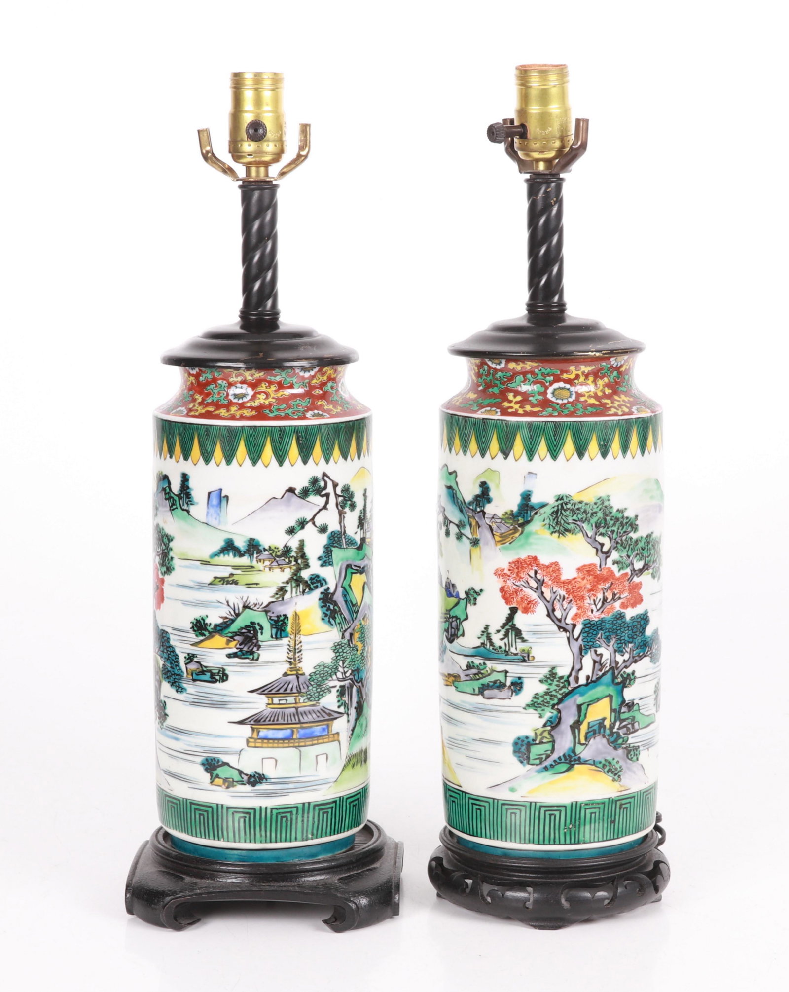 A Pair of Japanese Kutani Porcelain Lamps: Late 19th or early 20th century, each with hand painted landscape decoration, later electrified. Dimensions: Each porcelain body is 5 1/2" in diameter and 11 1/2" tall. The overall height is 20".