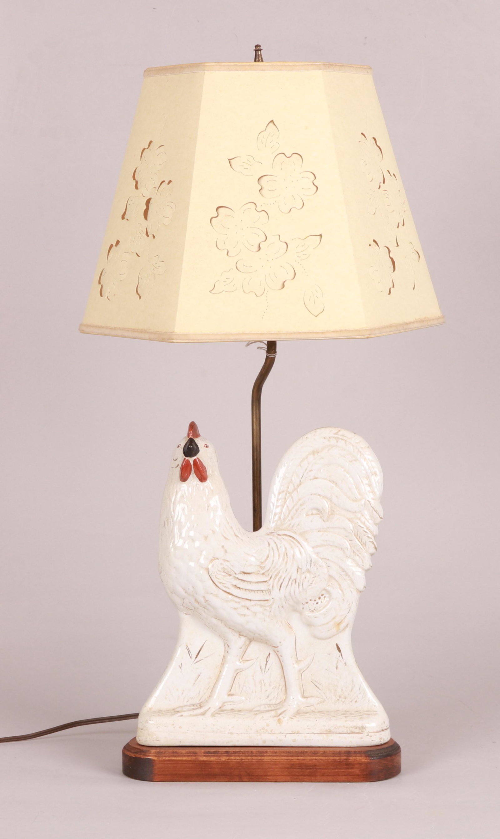 Staffordshire earthenware model of a cockerel: A Staffordshire glazed earthenware model of a cockerel, second half 19th century, now mounted to the base of a table lamp. Dimensions:height of Staffordshire 12 1/4in; height overall 19 1/4in Provenan