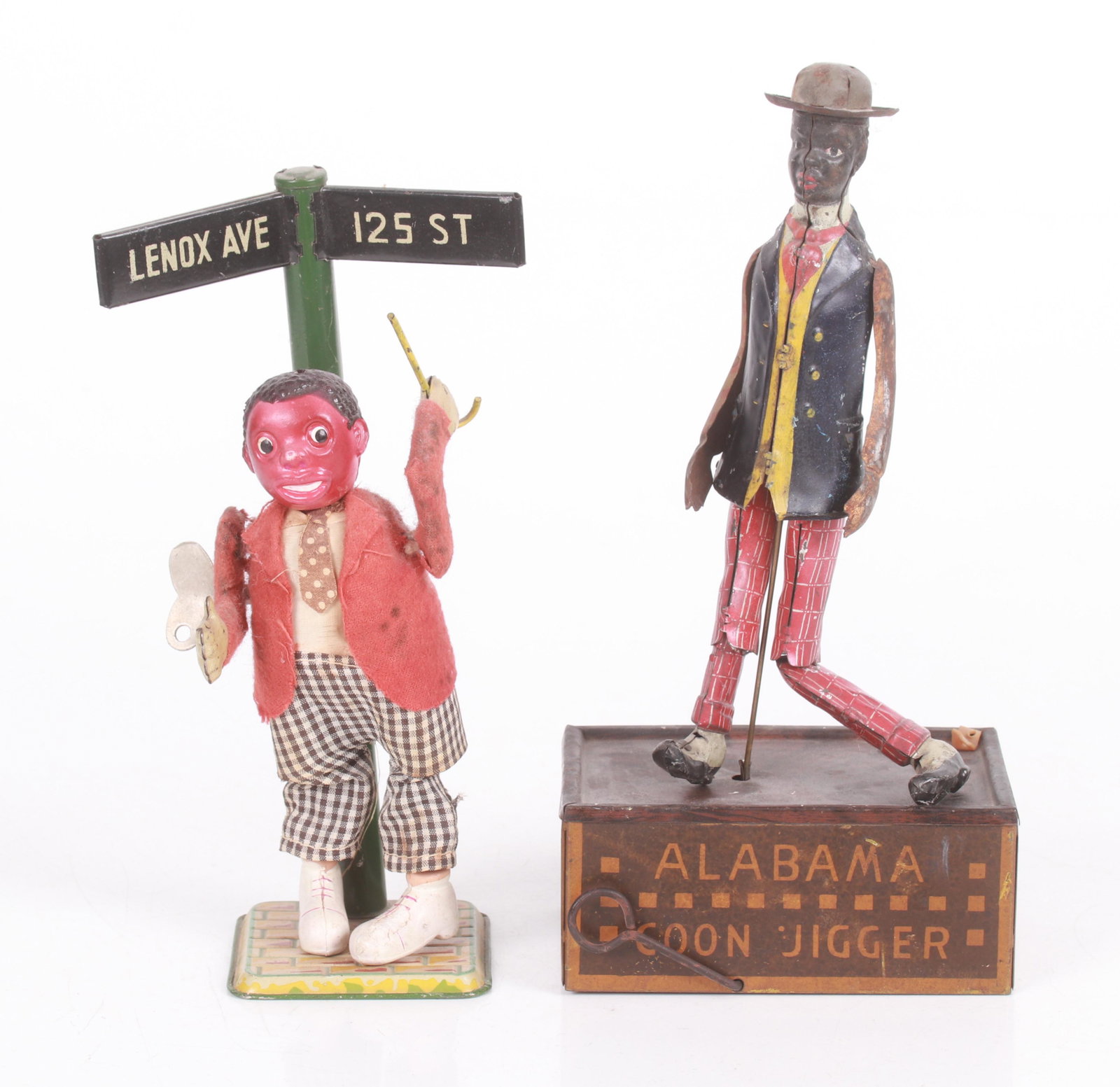 Black Americana, Two Toys: An occupied Japan tin and celluloid wind up dancing figure and a tin Alabama Coon Jigger key wind toy. Dimensions:3" x 2 3/4" and 4 3/4" x 3 1/4", the heights are 8 3/4" and 9 3/4".