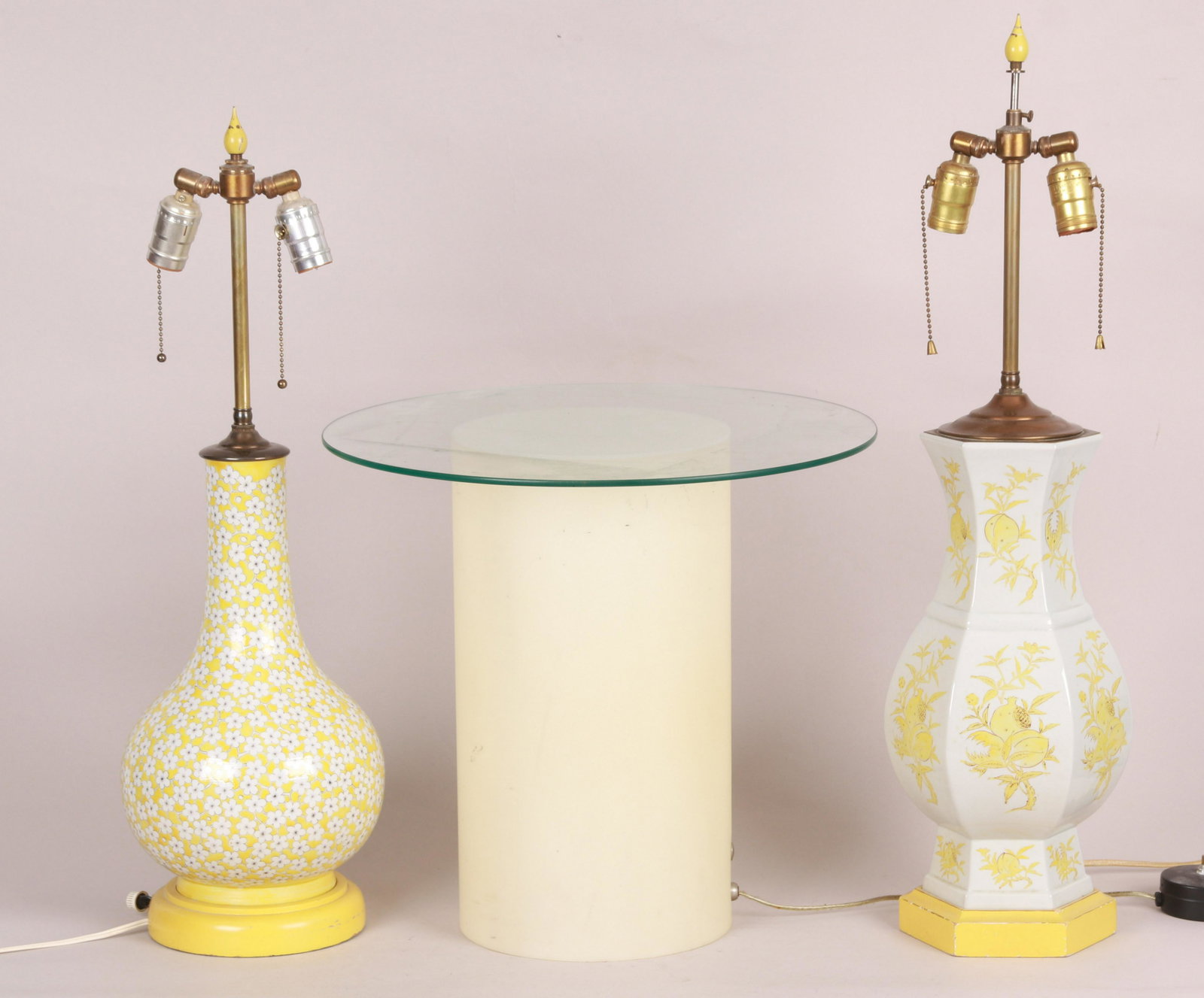 Two Mid Century Lamps and a Pedestal: Two Chinese style porcelain lamps with yellow decoration, and a Raymor Illuminated plastic stand with glass top. Dimensions:From 8" to 18" in diameter, heights range from 16" to 27" Provenance:From a