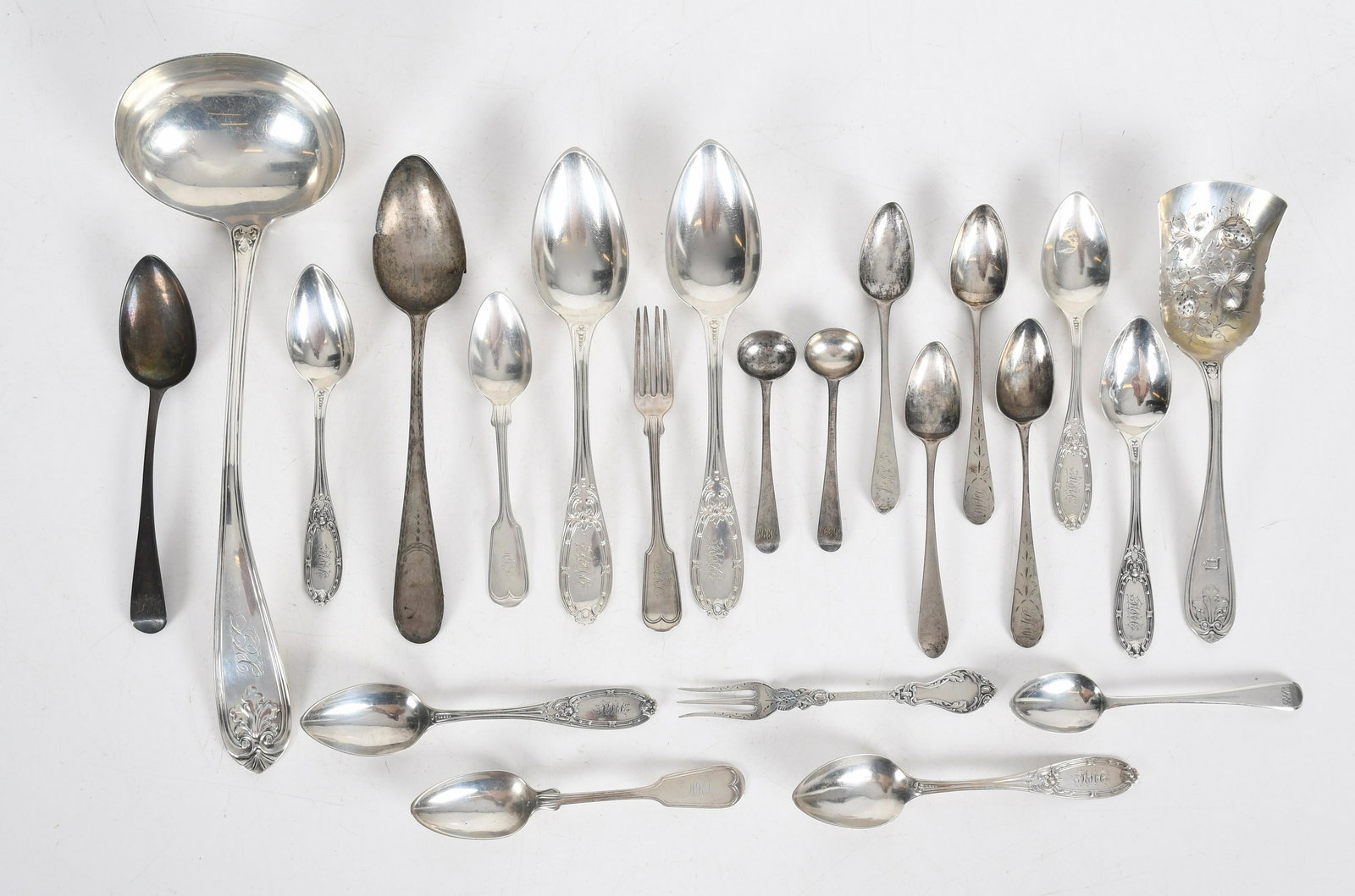 A Group of Coin and English Sterling Silver: Comprising: the coin silver pieces include a punch ladle by John Cook, a berry server by Albert Coles, five teaspoons by Albert Coles, two matching Albert Coles tablespoons, a pair of teaspoons by Joh