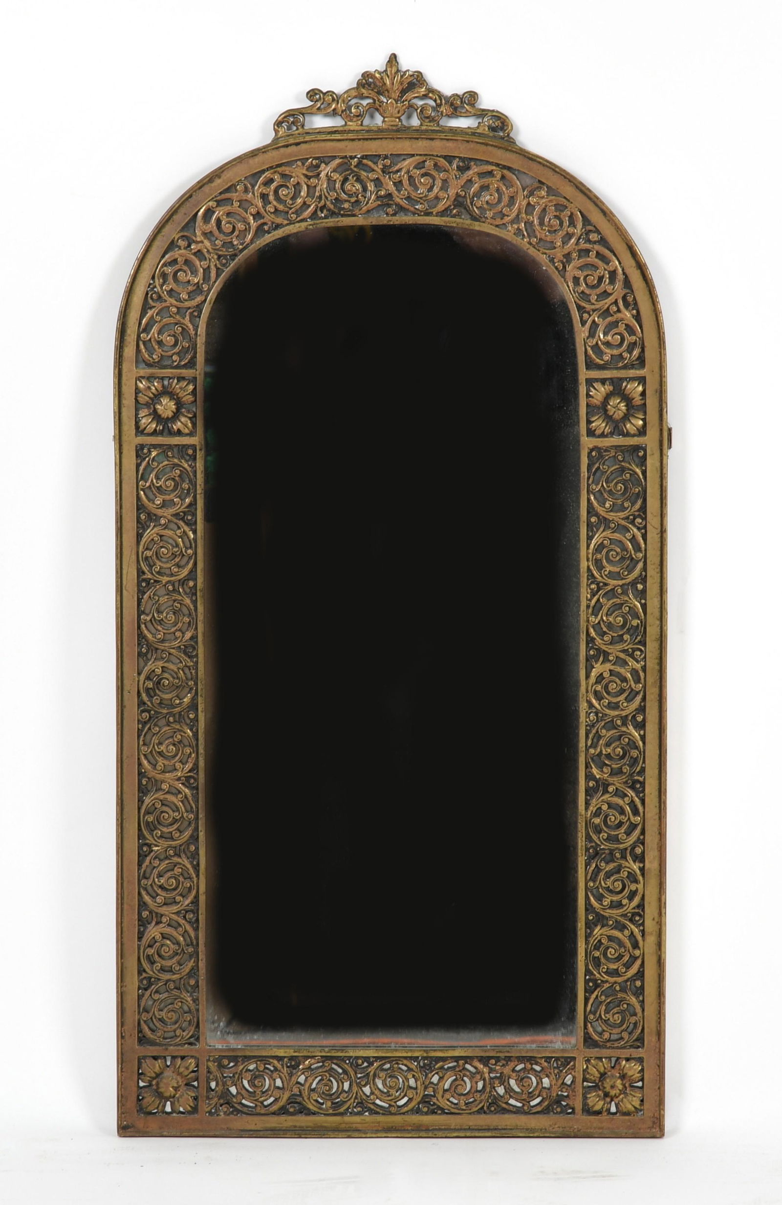 Pierced Gilt Bronze Mirror, Manner of Oscar Bach: A pierced gilt bronze mirror, manner of Oscar Bach, early 20th century. Dimensions:Height 32 3/4in; width 16 3/4in.