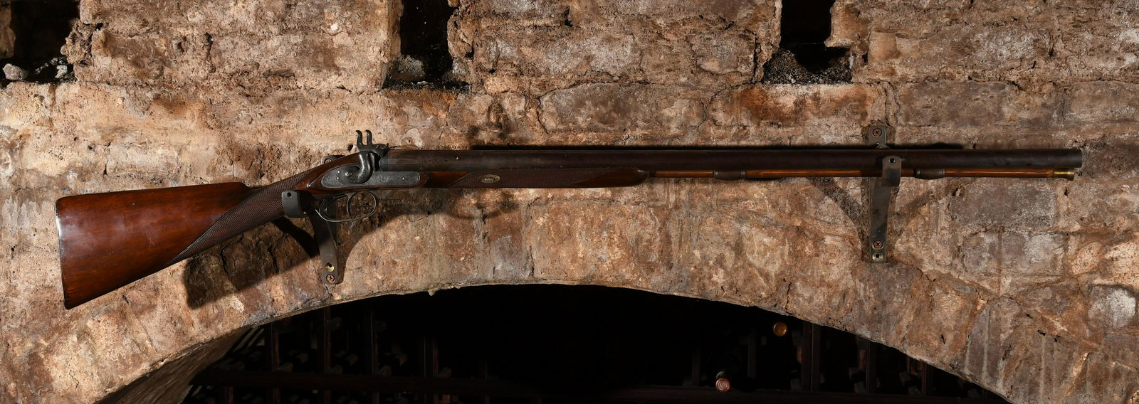 A Circa 1850 Double Barrel Shotgun: Probably English, "Superior Twist" engraved in gold on the damascus barrel. Dimensions:The barrel is 31 1/2" long, the total length is 47". IMPORTANT NOTE: ALL preview and pickups for this sale are BY