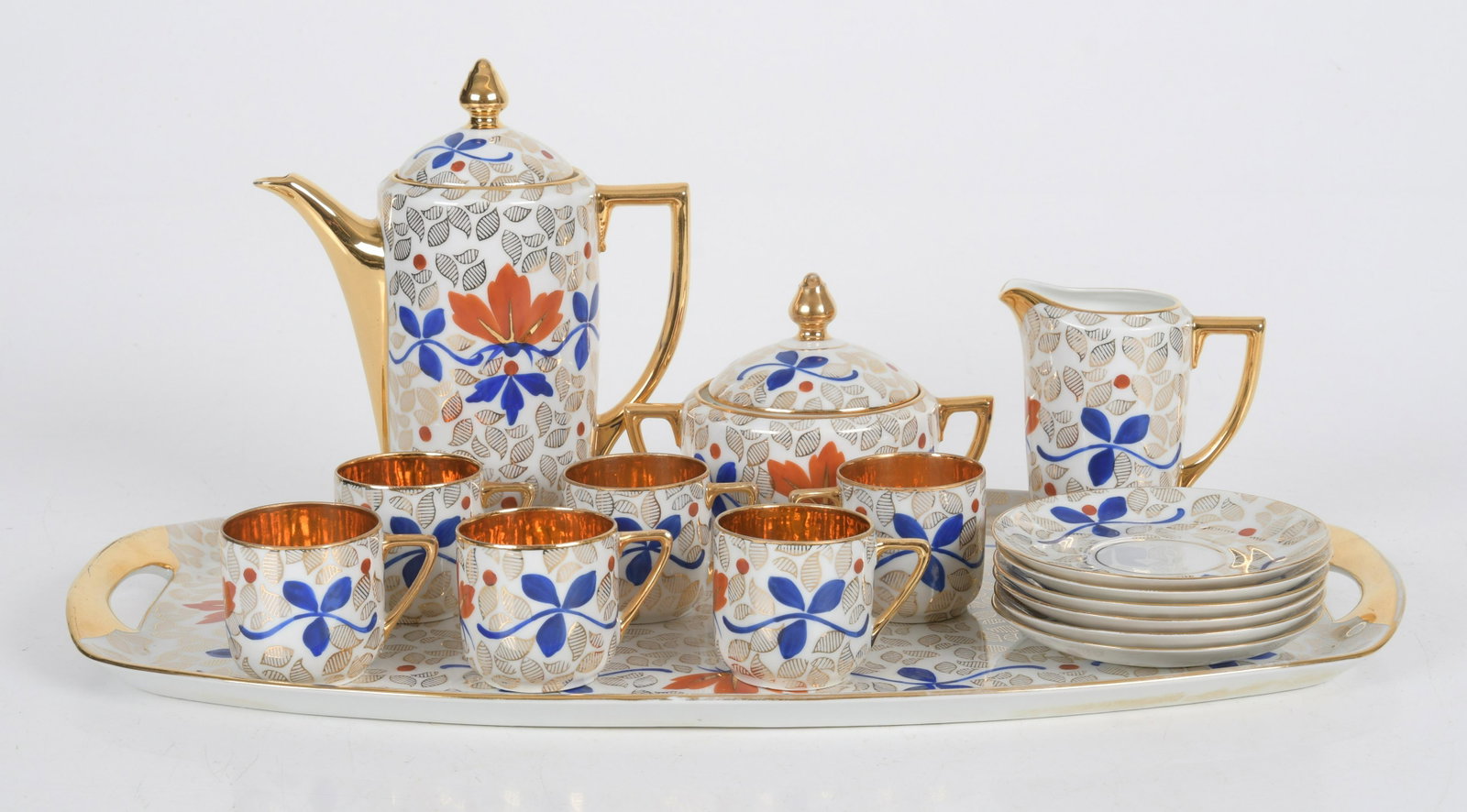 A Vienna Style Porcelain Demitasse Set: Czech, six cups, six saucers, coffeepot, sugar, creamer and tray. Each with blue, red and gilt decoration. Marked as pictured. Dimension:The tray is 19" x 11", the heights range from 2" to 8 1/2". Pro