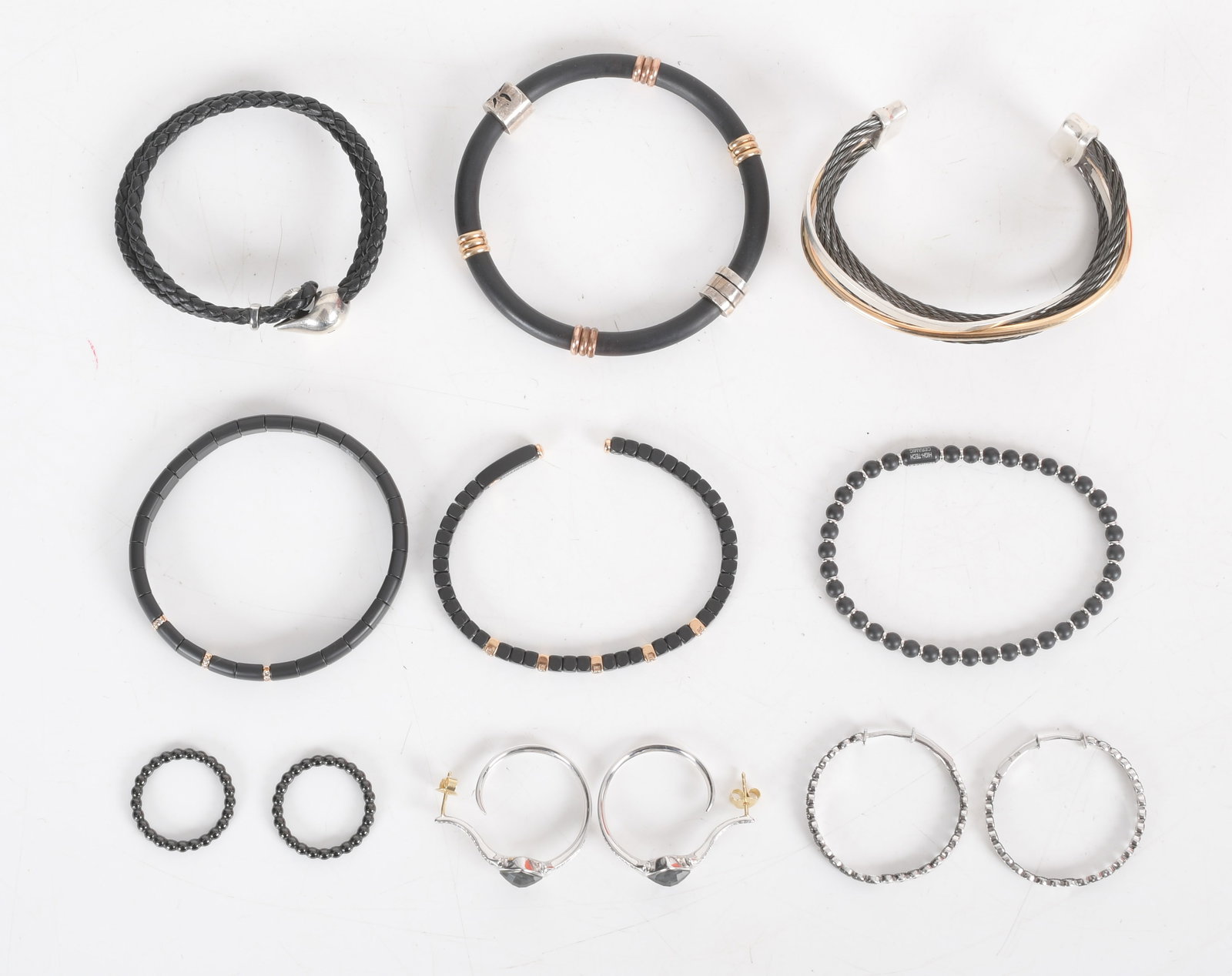10 Pieces of Designer Jewelry signed 18K Diamond Sterling Jewelry: Signed pieces by Kwait, Roberto DeMeglio, Stephen Webster and Jude Frances. Three 18k gold, diamond, and black ceramic flexible bracelets by Roberto DeMeglio, one bracelet sterling with diamond by Kwa
