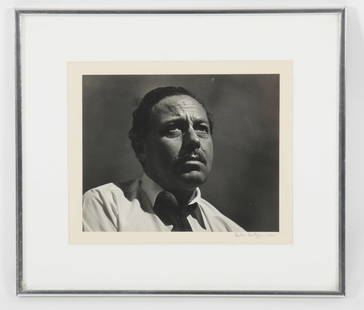 Herb Snitzer (American, b. 1932) Tennessee Williams: A silver gelatin photograph of the author, signed and dated for 1961. Dimensions: The photograph is 7 3/4" x 9 3/4", the frame 14" x 16".