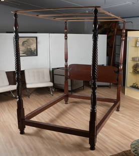 An American Classical Mahogany Tester Bed: An American Classical carved mahogany tester bed, circa 1840. A tall post bed with acanthus and rope twist carved posts and a shaped headboard with scrolled ends. Dimensions: The outer dimen