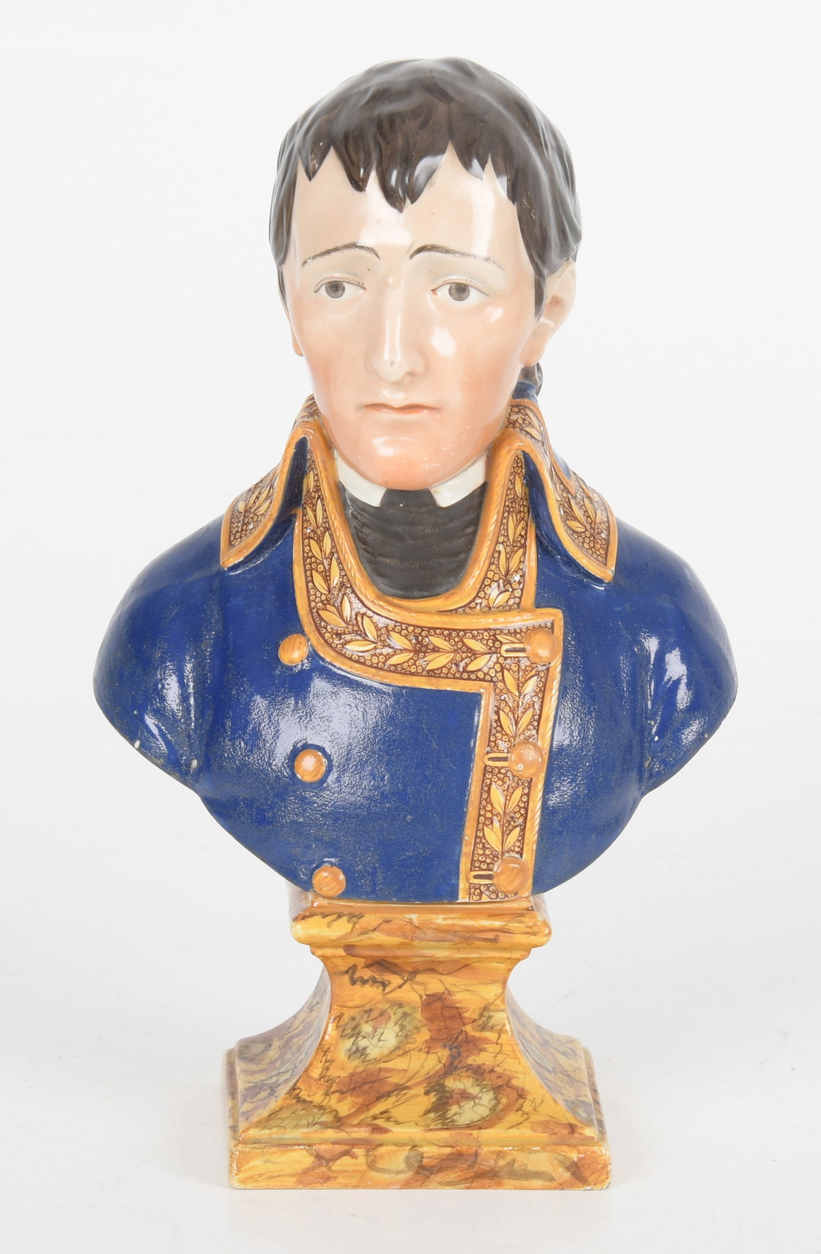 Pearlware Bust of Napoleon Bonaparte ca. 1815: A Pearlware Bust of Napoleon Bonaparte, Circa 1815. A well decorated bust of a young Napoleon Bonaparte, impressed verso, "BONAPARTE". There is a sticker at the base that indicates the piece