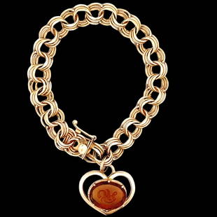 14K Gold Charm Bracelet w/ charm: 14K Yellow gold charm bracelet with a heart shape charm set with a citrine stone with carved initials. Measures: Bracelet - 7.5in L x 10.5mm WideCharm – 1in x 1inHallmark: 14KGross Weight: 18.4dwt /