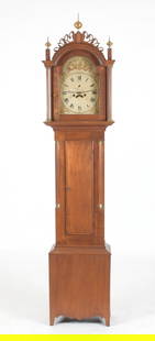 New England Federal Walnut Tall Case Clock: A New England Federal Walnut Tall Case Clock, Early 19th Century. The white-painted arched dial having Roman hours and Arabic minutes, the arch and spandrels decorated with gilt heightened urns and fo