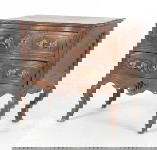 Louis XV Provincial Carved Walnut Commode: A Louis XV Provincial Carved Walnut Commode, Mid 18th Century. The rectangular top with serpentine front over a conforming case with two drawers, the shaped apron centered by a pierced scallop sh