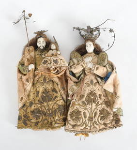 Pair of Spanish Colonial 'Sagrada Familia' Figures: A Pair of Spanish Colonial 'Sagrada Familia' (Holy Family) Carved Figures, 19th Century. Comprising Virgin Mary, Saint Joseph, and Christ Child. Each with glass eyes, wearing silk and met