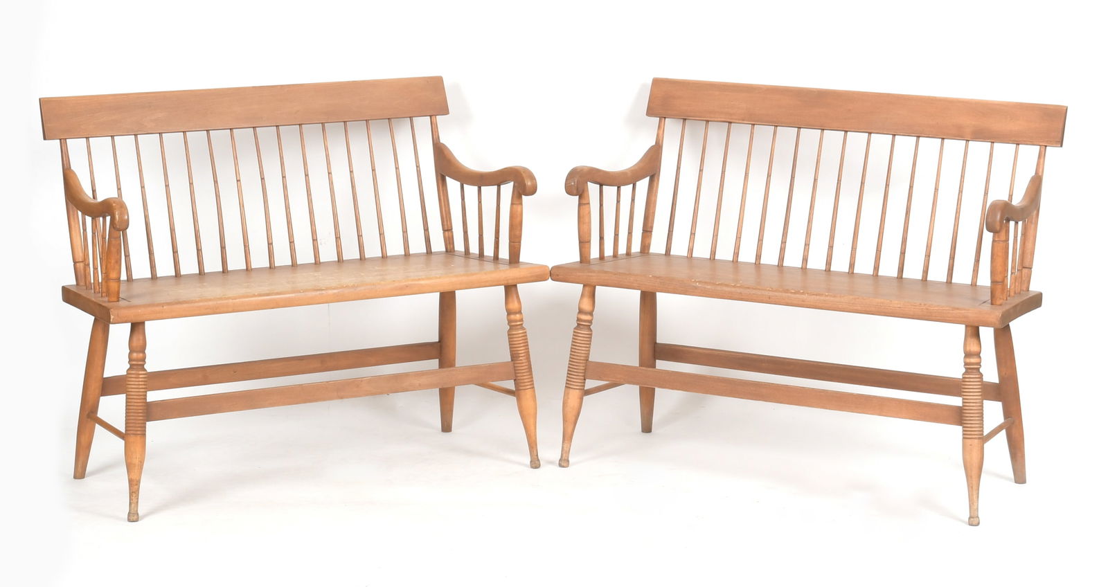 Pair of Maple Windsor Settees, Duckloe Bros Inc: A Pair of Maple Plank Seat Windsor Settees by Duckloe Bros. Inc, 20th Century. Each having a brown wash. One inscribed to the underside 'DUCKLOE BROS. INC / COLONIAL / REPRODUCTIONS / PORTLAND, PA