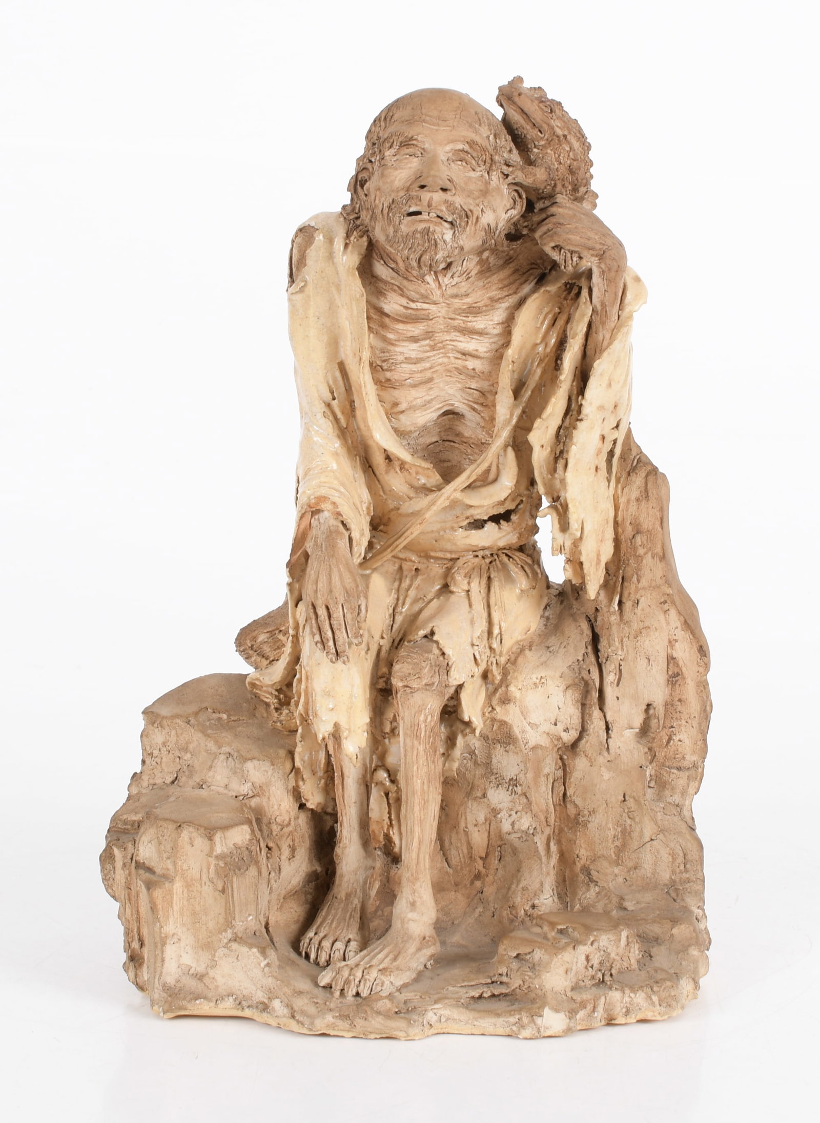 A Japanese Pottery Figure of Gama-Sennin: A hand modeled example composed of glazed and unglazed elements, 19th century, unmarked. Dimensions: 8" x 7", the height is 13". Provenance: fr
