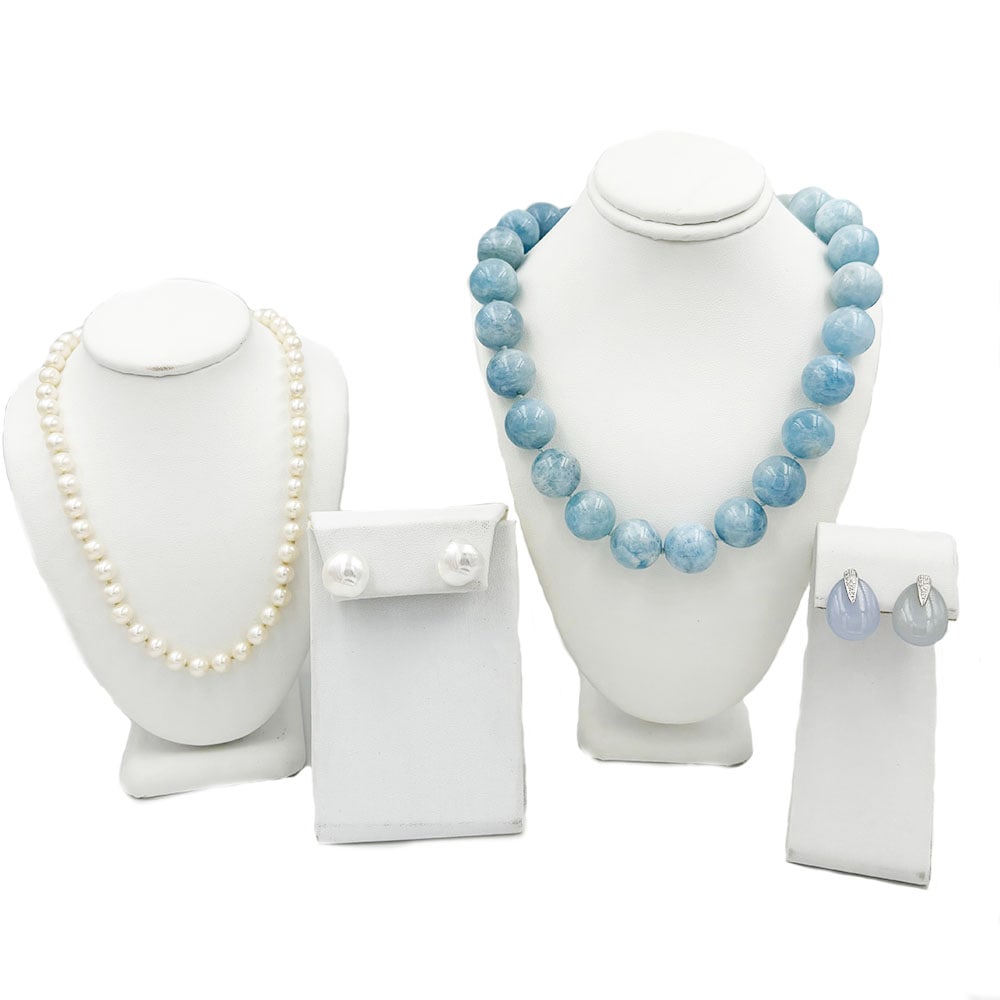 Movado 18K 14K Jewelry Lot Necklace Earrings: Four-piece lot that includes, a 19” cultured 6mm pearl necklace with 14k yellow gold clasp, an 18K white gold 15mm round dyed blue quartz bead necklace,18in long, a pair of baroque pearl earring