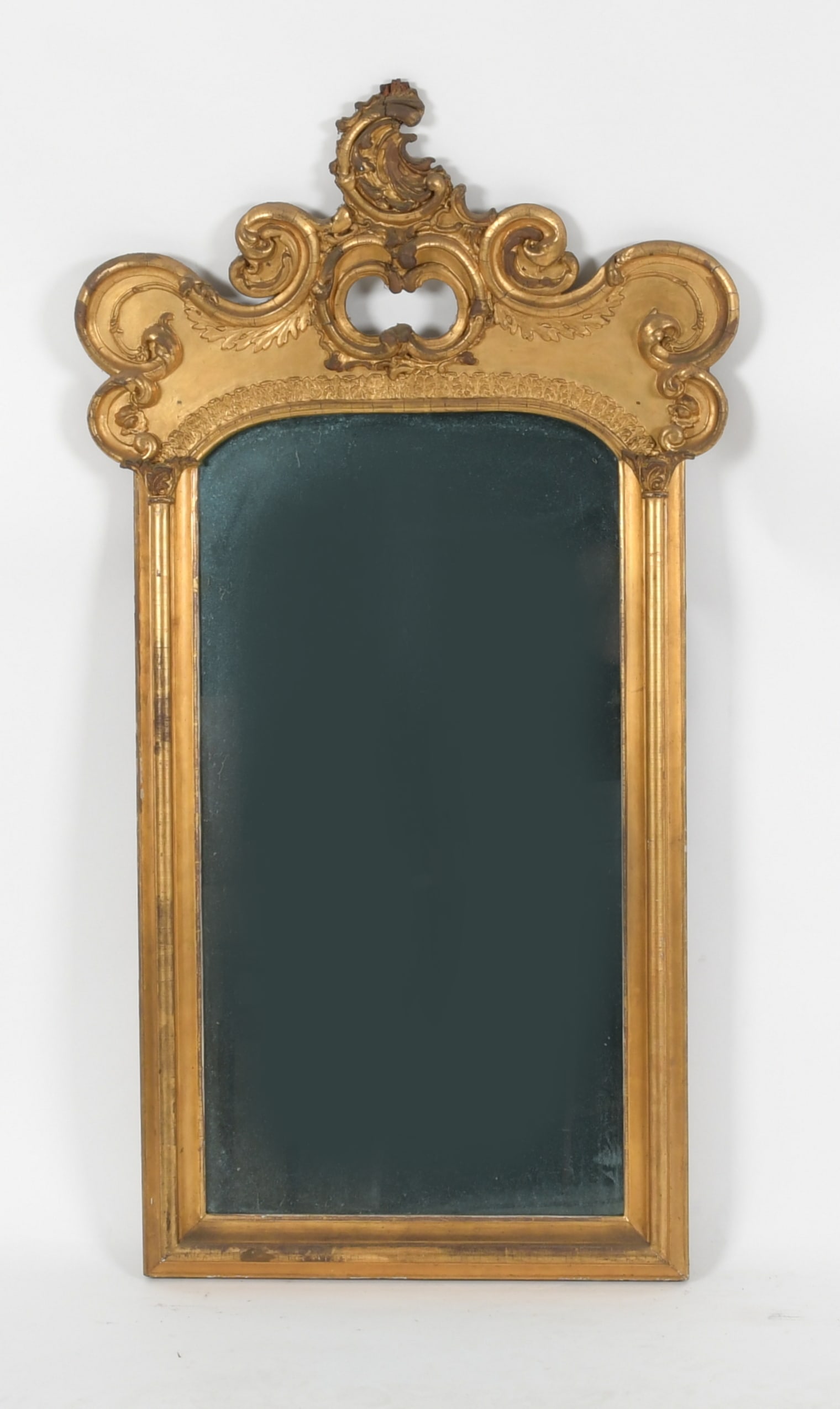 Rococo Style Carved Giltwood and Gesso Mirror: A Rococo Style Carved Giltwood and Gesso Mirror, Late 19th/Early 20th Century. Dimensions: Height 55in; width 30 1/4in; depth 3 3/4in.