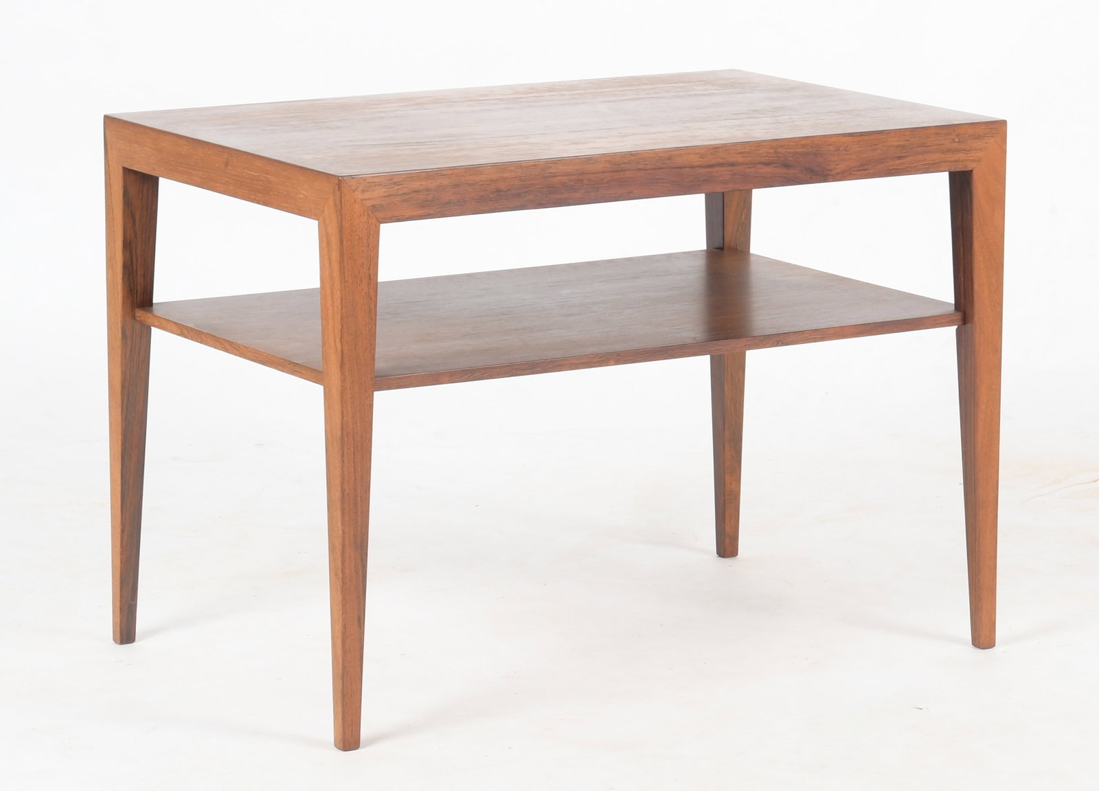 Severin Hansen Danish Modern Rosewood Table for Haslev Mobelsnedkeri: A Danish Modern Rosewood Side Table, Designed by Severin Hansen for Haslev Mobelsnedkeri, Circa 1960s. The rectangular top with square tapered legs, joined by an under-tier. With 'Danish Furniture