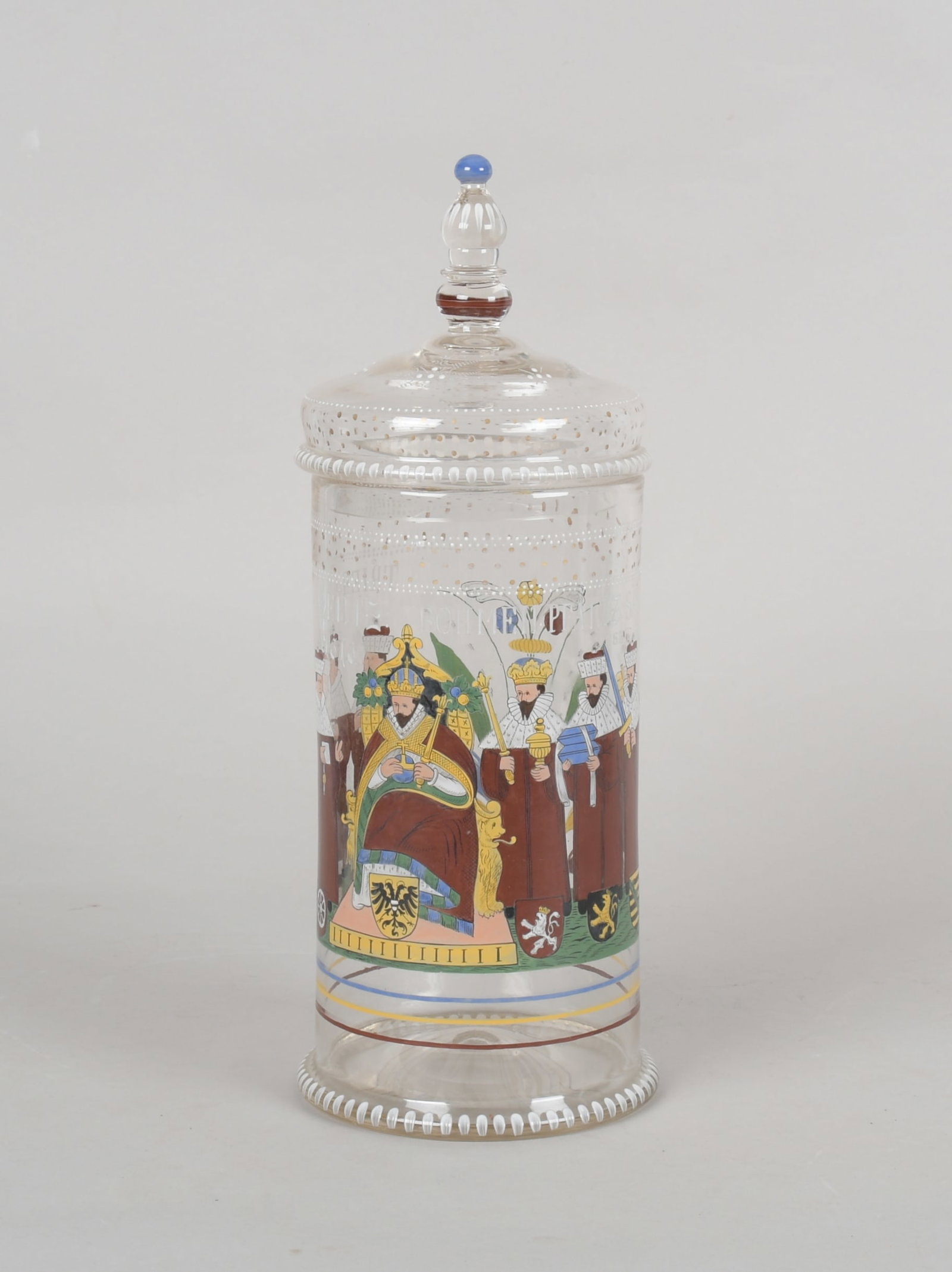 A Large Covered Glass Jar Att. to Fritz Heckert: A large enamel decorated jar with figural decoration and the text, Trier.Collin.Mentz. Bohman. Pfaltz.Sach.Branden. 1616. Dimensions: 7" in diameter, the height is 17". 