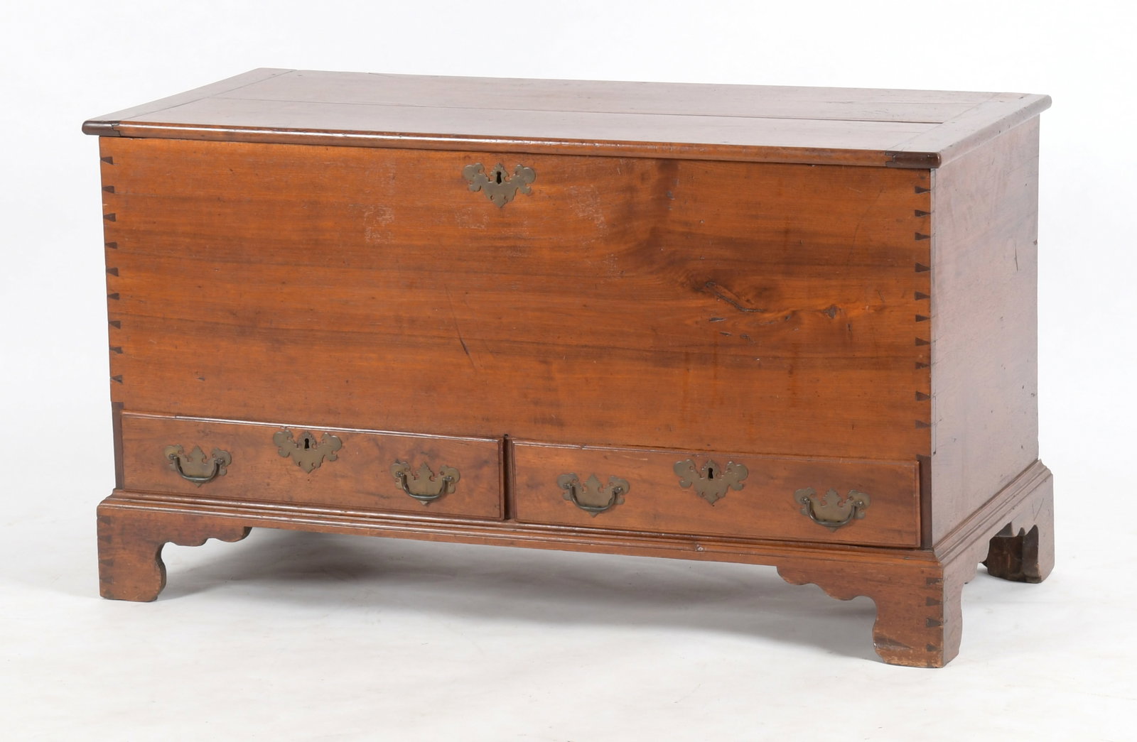 Pennsylvania Chippendale Walnut Blanket Chest: A Pennsylvania Chippendale Walnut Blanket Chest, Late 18th / Early 19th Century. The hinged rectangular top with breadboard ends enclosing a dovetail-constructed box having a right covered t