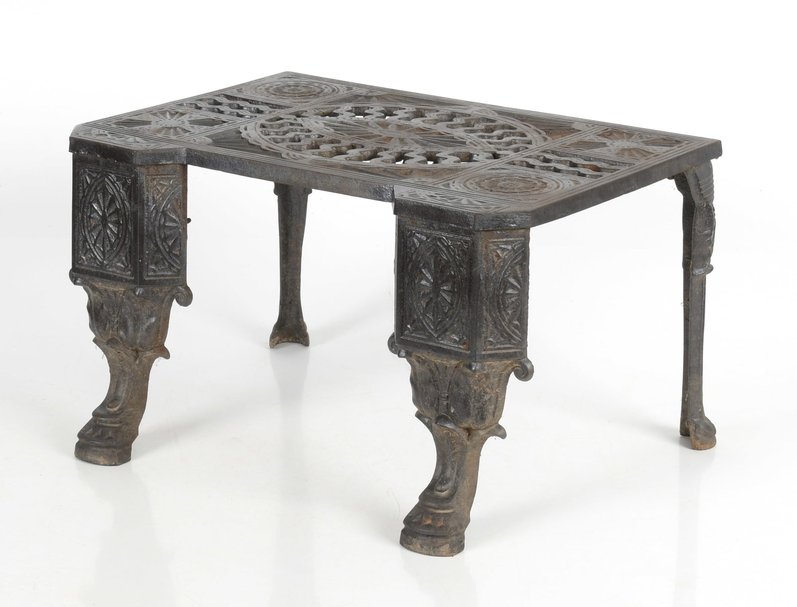 Aesthetic Movement Pierced Cast Iron Footman / Plate Warmer: An Aesthetic Movement Pierced Cast Iron Footman / Plate Warmer, Late 19th Century. Dimensions: Height 12in; width 20in; depth 14 1/4in. Provenance: Property from a Local Collection.