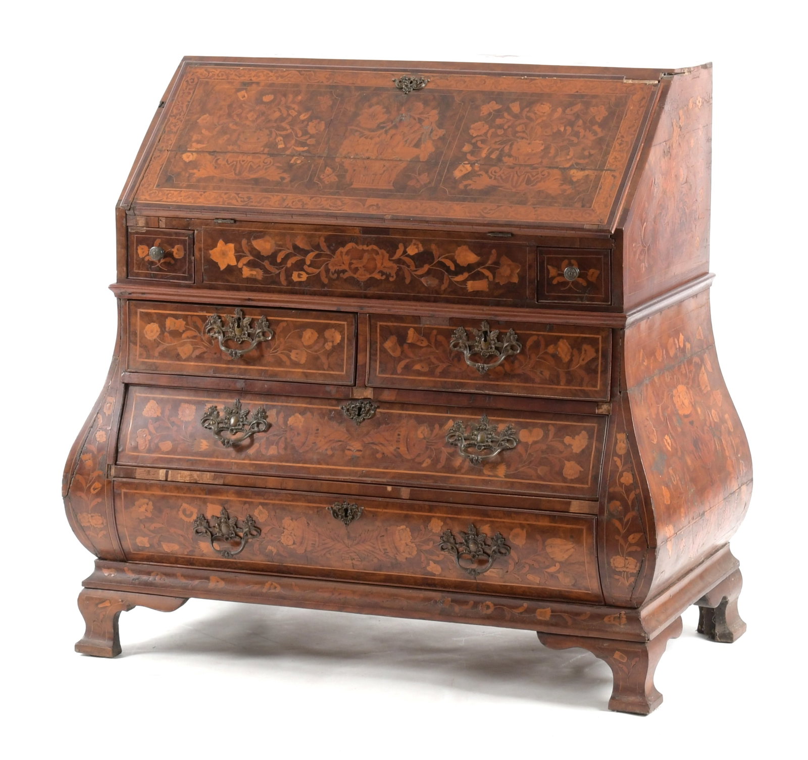 Dutch Baroque Floral Marquetry Inlaid Walnut Bombe Slant Front Desk: A Dutch Baroque Floral Marquetry Inlaid Walnut Bombe Slant Front Desk, 18th Century. In two-parts. The upper section with hinged fall reversed by an inset writing panel, enclosing an interior with six