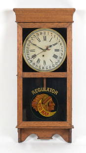 Red Man Chewing Tobacco Advertising Oak Regulator Clock, E. Ingraham Company: An American Oak Regulator Clock, E. Ingraham Company, Bristol, Connecticut, Early 20th Century. Having a circular paper dial with Roman hours and Arabic numerals to the calendar. With single train mov