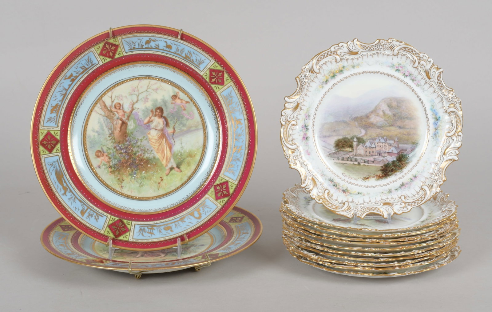 A Group of English and Czech Porcelain Plates: A set of eleven hand-painted plates by Hammersley England. Each depicting a different location including Loch Ness, Stirling, and others. And a pair of transfer decorated Czech plates in the Vienna st