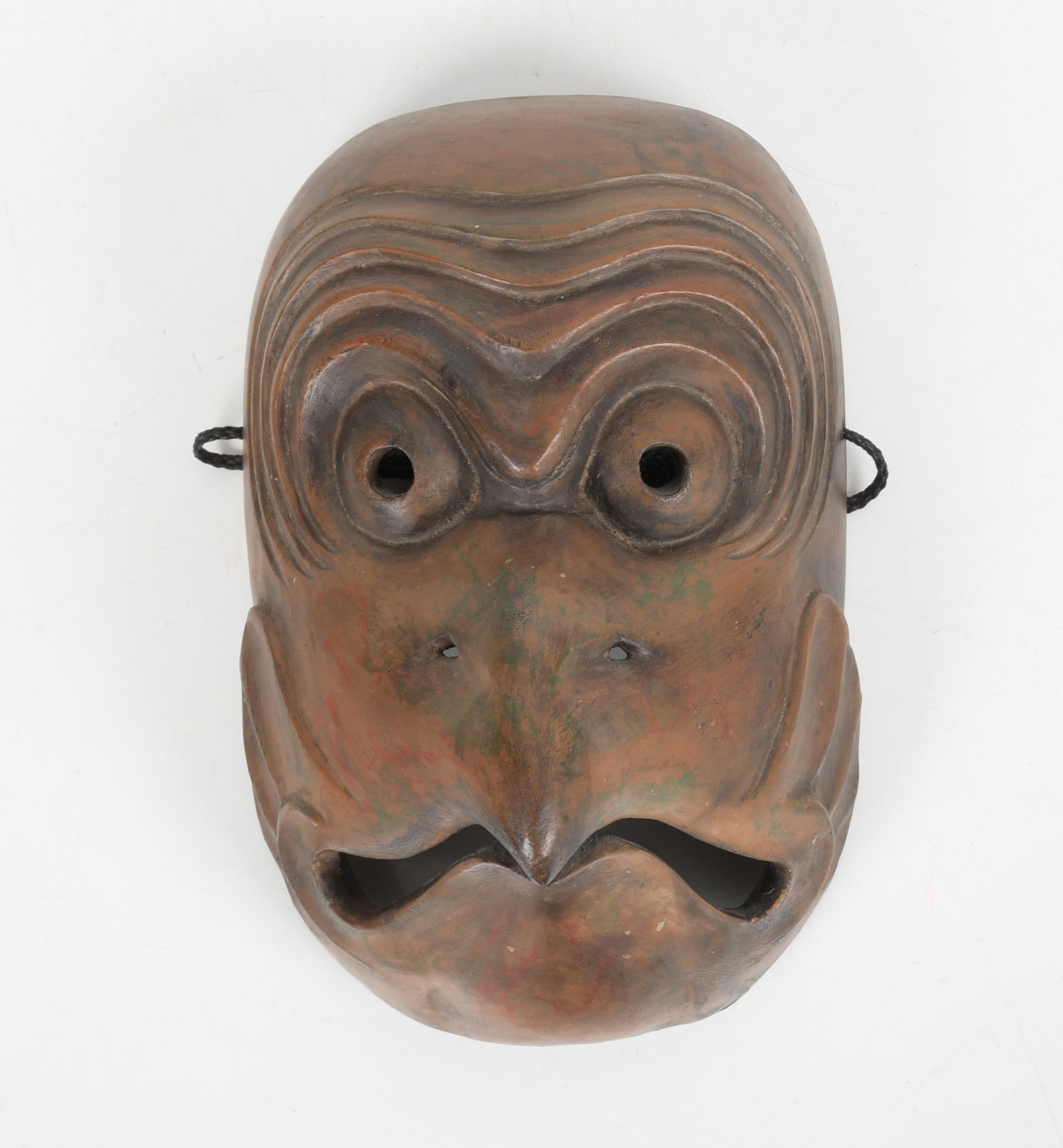 A Japanese Carved Wooden Bugaku Mark: A well carved example, probably Meiji period. Dimensions: 9" x 5 1/2". Provenance: From a Philadelphia collection.
