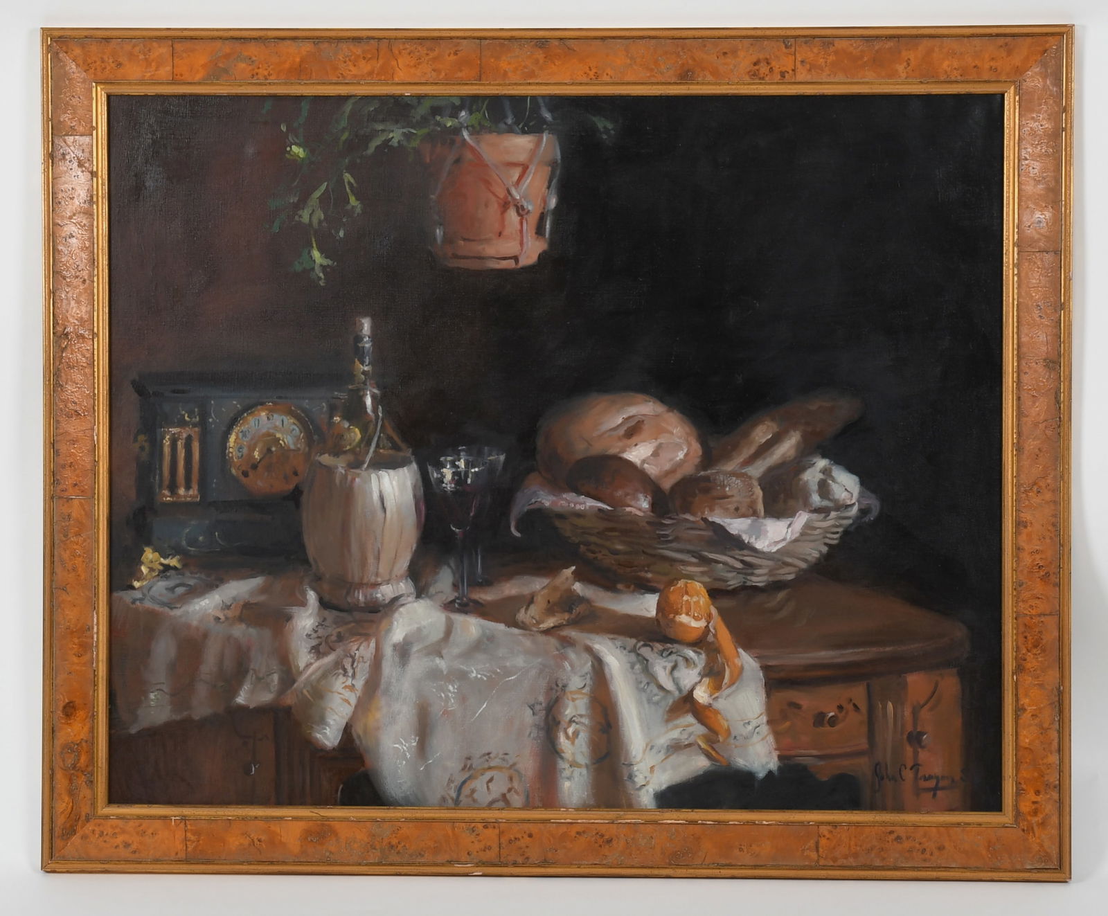 John C. Traynor (Born 1961) Oil on Canvas: John C. Traynor (Born 1961) Oil on Canvas. A large still life with basket of bread, peeled orange, bottle of wine and a mantle clock, signed at the lower right. Dimensions: 35in x 44in, t