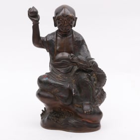 A Chinese Bronze Champleve Figure of a Luohan