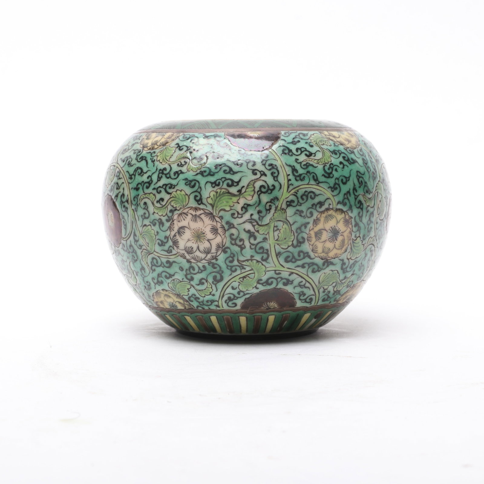 An Edo Period Japanese Ko Kutani Jar: An Edo Period Japanese Ko Kutani Jar With a green ground and floral decoration, pictorial mark as pictured. Dimensions: 4 1/8in diameter, the height is 3in. 
