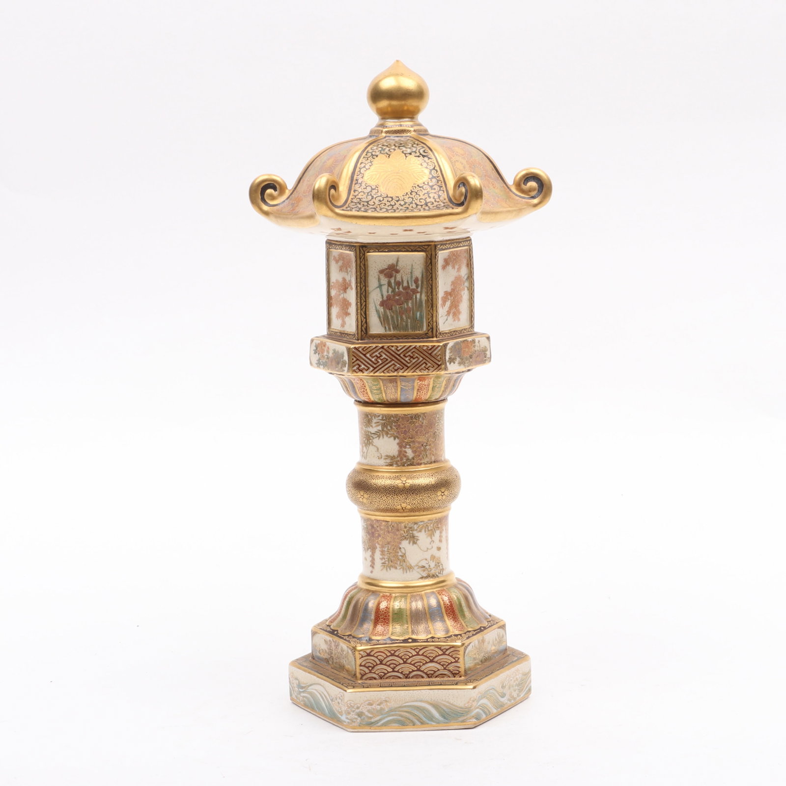 A Satsuma Lantern Form Okimono, Meiji Period: A Satsuma Lantern Form Okimono, Meiji Period An hexagonal example decorated with flowers, waves and the Toyotomi Clan mon, marked for Senzan. Dimensions: 6in diameter, the height is 12 3/4
