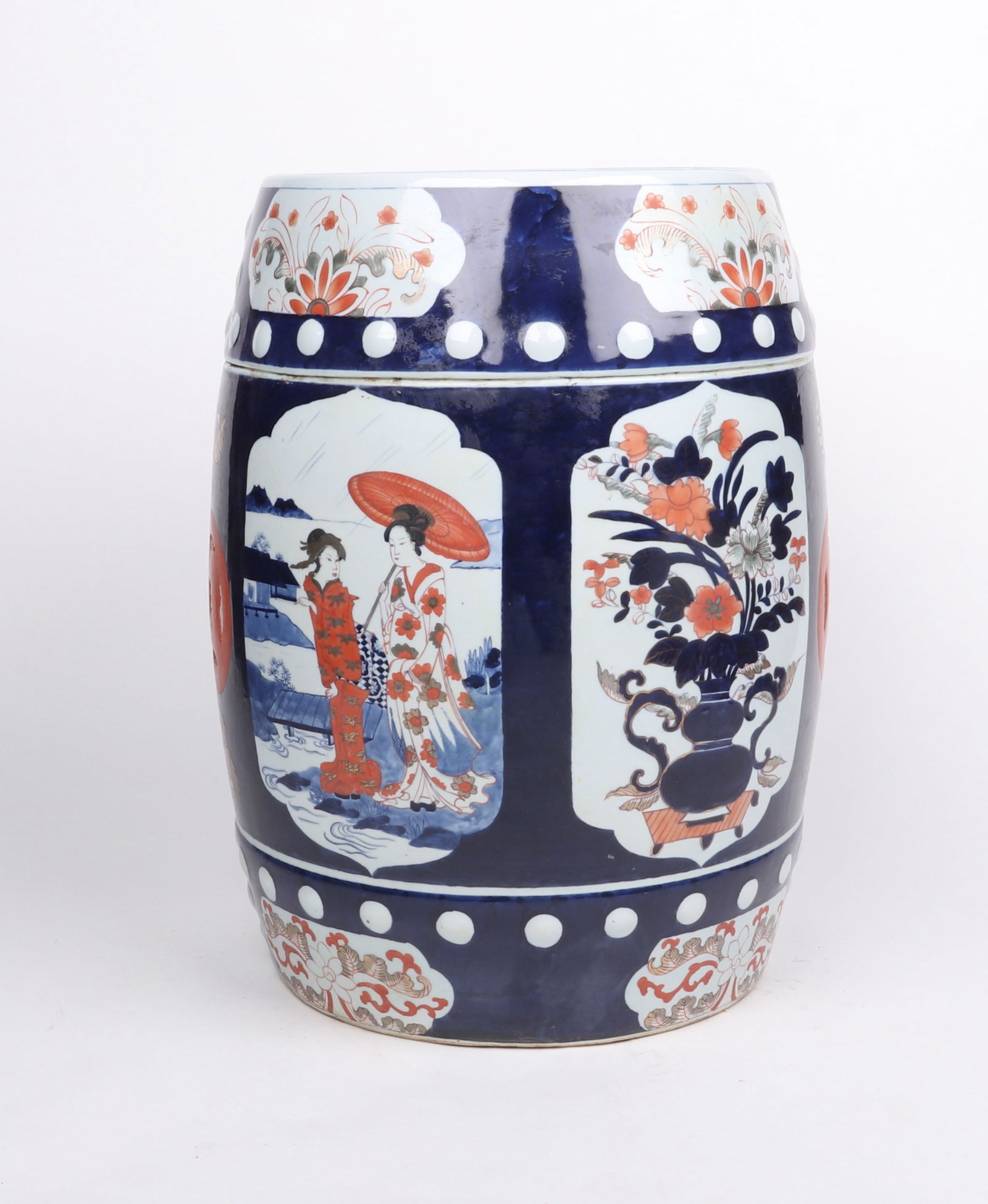 A Japanese Imari Porcelain Garden Seat: A Japanese Imari Porcelain Garden Seat Circa 1900, drum form with reserves of figural decoration. Dimensions: the top diameter is 11in, the height is 18 1/2in. 