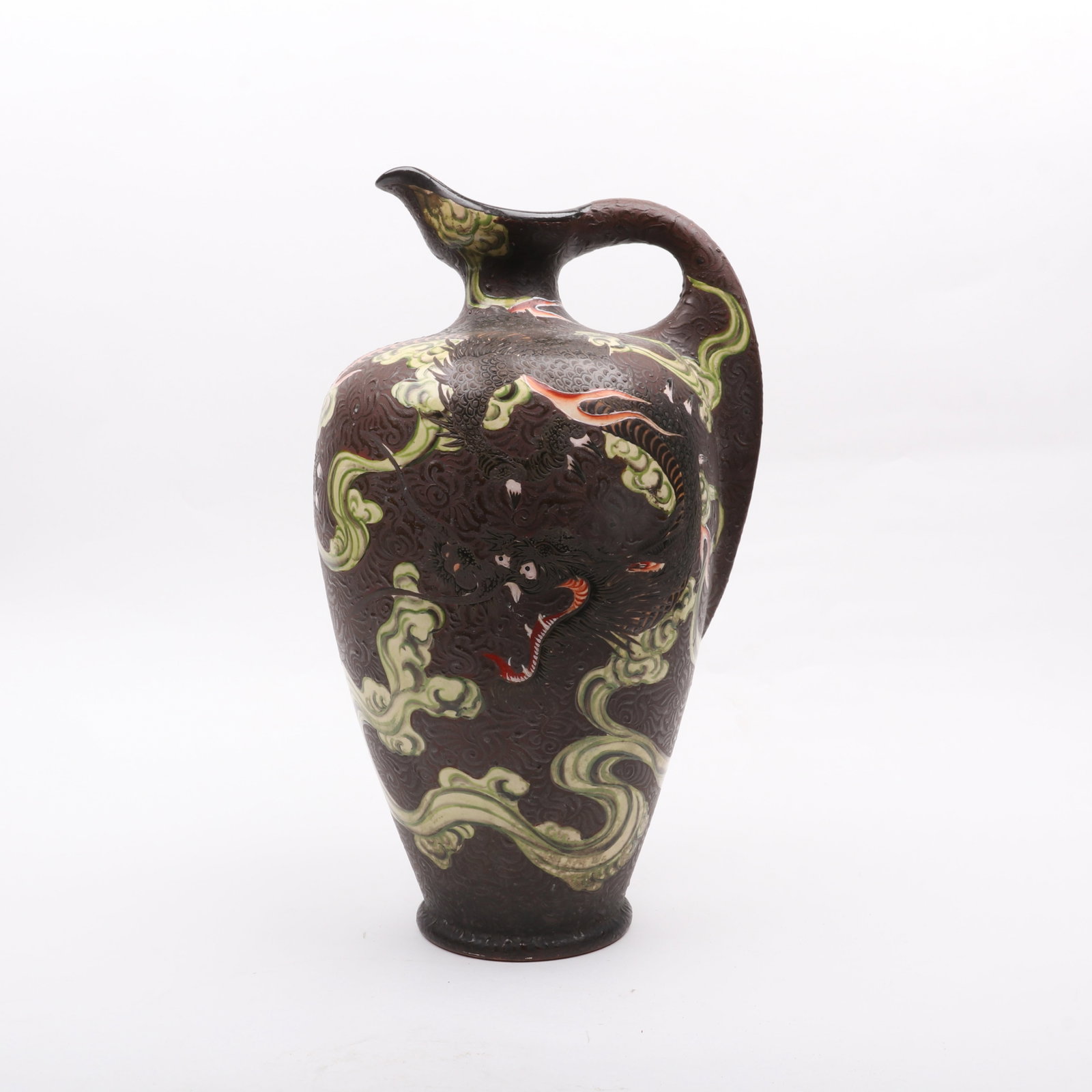 A Large Japanese Satsuma Ewer: A Large Japanese Satsuma Ewer Early 20th century, with a brown glaze with polychrome dragon and cloud decoration, signed as pictured. Dimensions: 11in x 9in, the height is 18 3/4in. <