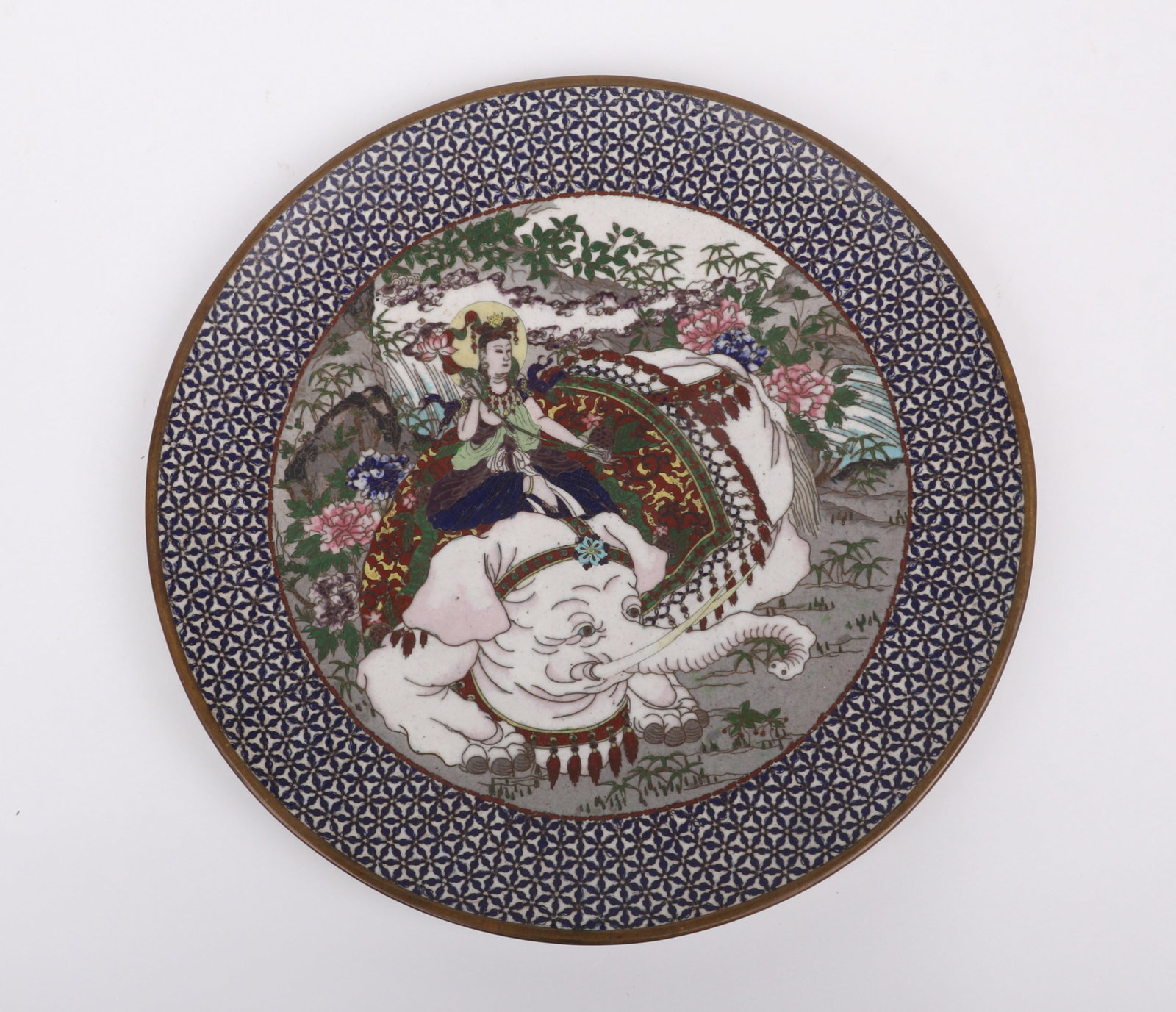 A Japanese Cloisonne Charger: A Japanese Cloisonne Charger An early 20th century example decorated with a figure riding a white elephant. Dimensions: 12in diameter. 