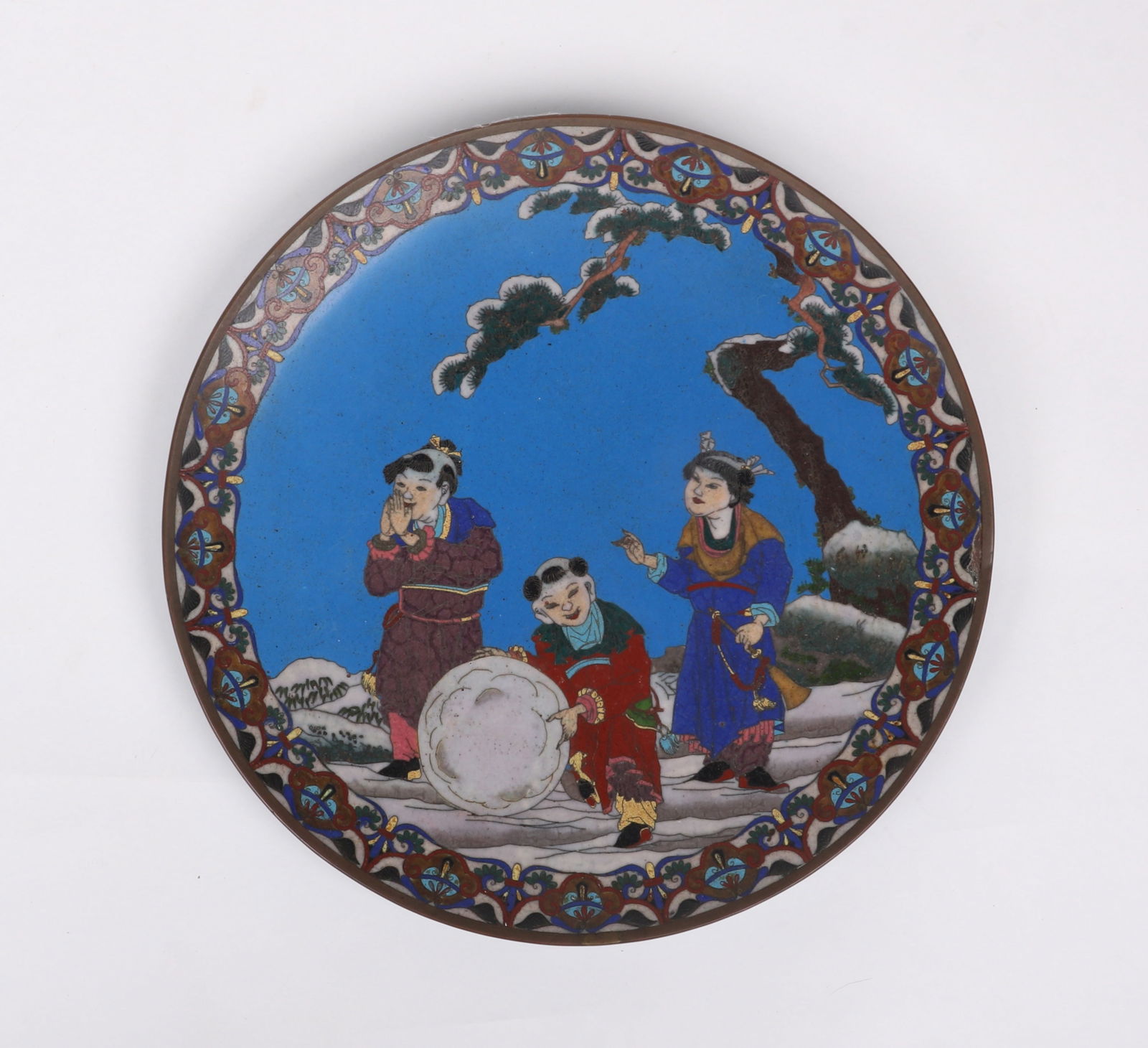 A Japanese Cloisonne Charger: A Japanese Cloisonne Charger 19th or early 20th century, the decoration depicting children playing in snow. Dimensions: 12in diameter. 