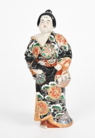 A Japanese Kutani Porcelain Figure of a Sumo Wrestler