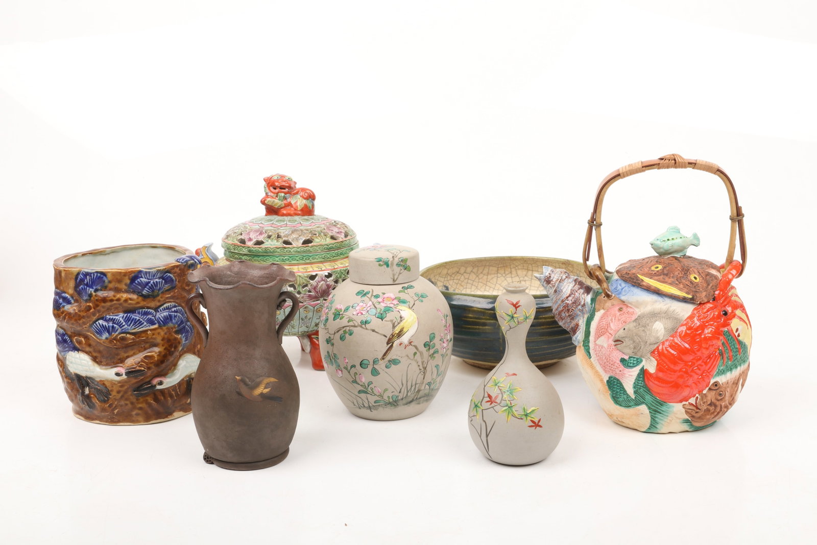 A Group of Japanese Ceramics Including Banko Ware: A Group of Japanese Ceramics Including Banko Ware Comprising: a bowl with a green exterior and a crackle glaze with landscape decoration, a colorful koro with mask and ring handles, a sma