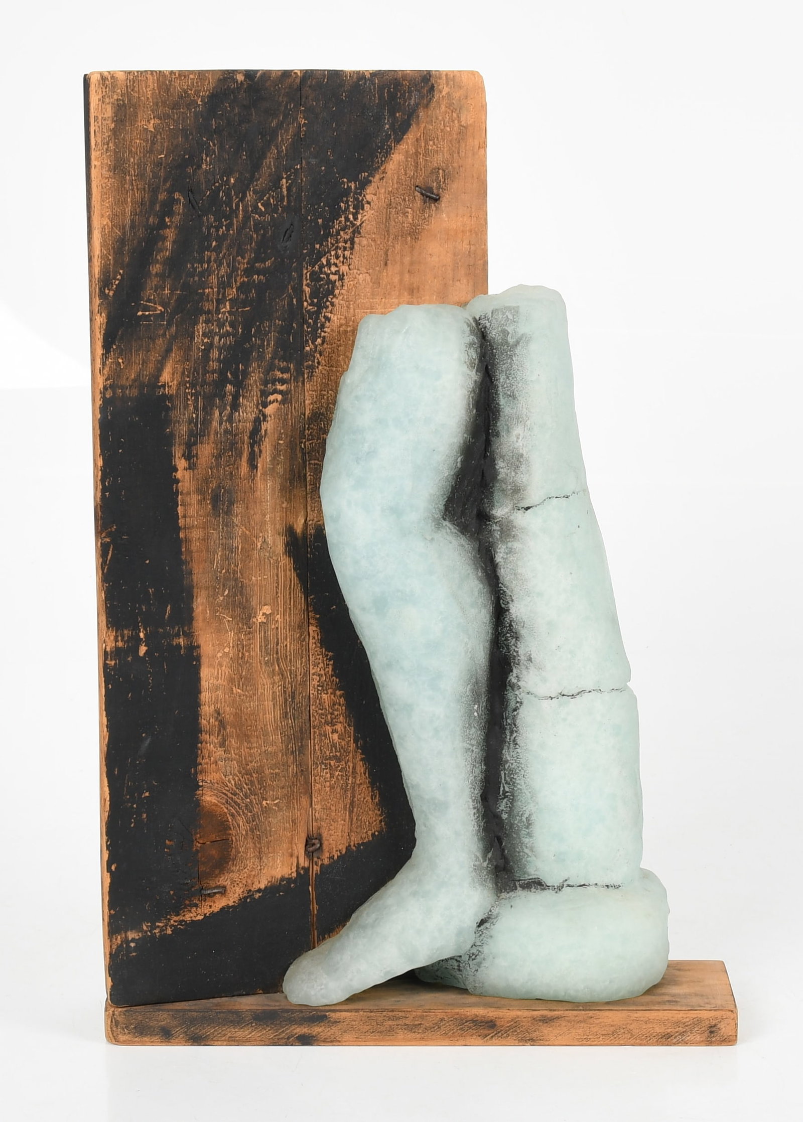 A Cast Glass and Wooden Sculpture: A Cast Glass and Wooden Sculpture An unsigned late 20th century example. Dimensions: 12in x 3 1/2in, the height is 18in. Provenance: Collection of Madge Goldman