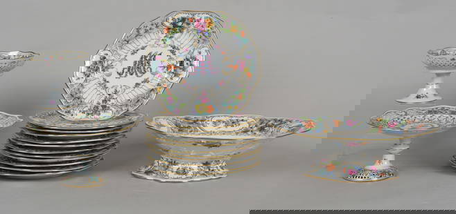 A Group of Dresden Porcelain Tableware: A Group of Dresden Porcelain Tableware All from the first half of the 20th century, comprising: a set of twelve reticulated 'Marie Antoinette' pattern 9 1/4in plates, a compote in the sa
