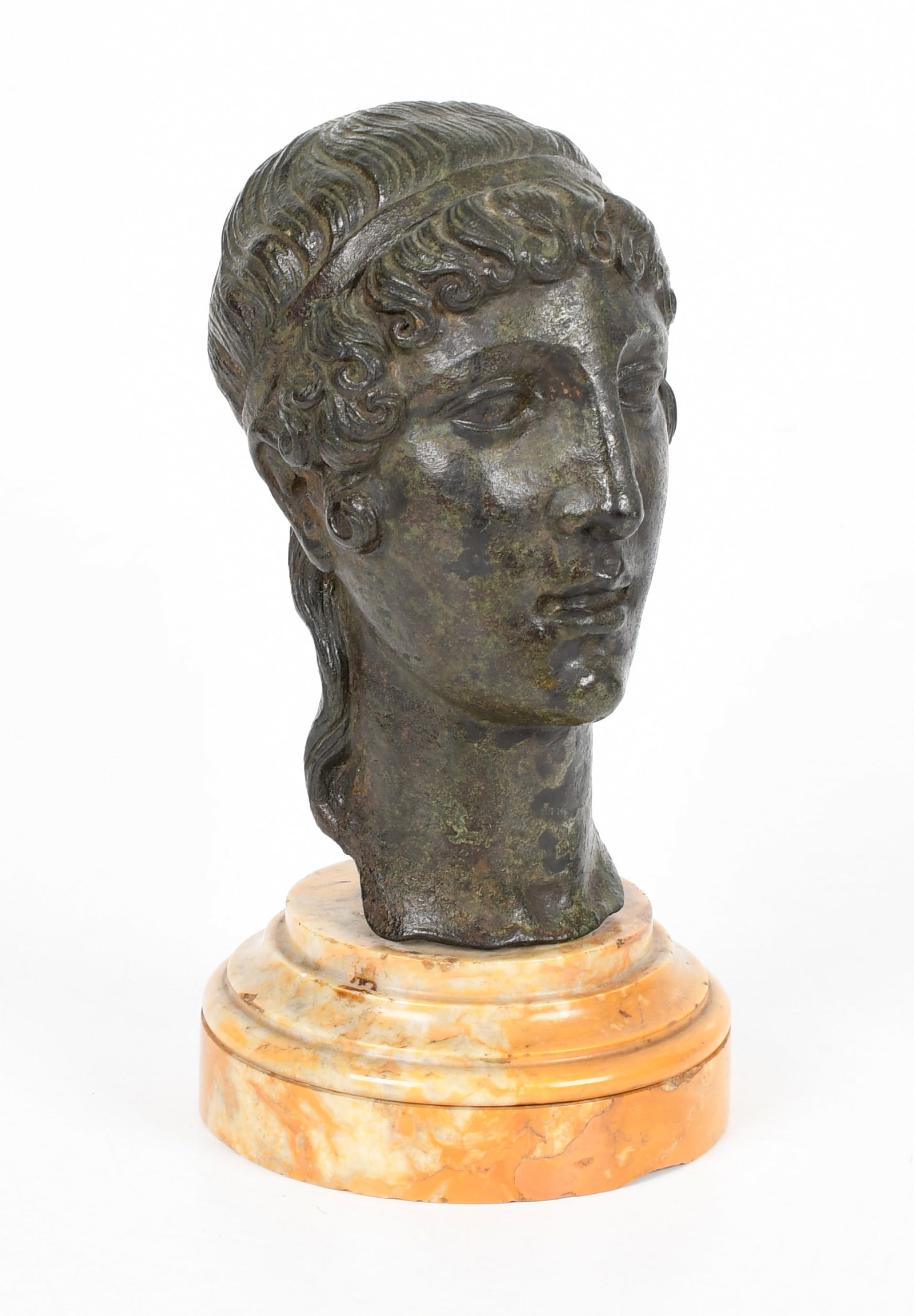 Grand Tour Bronze Head of a Youth, 19th Century: A Grand Tour Bronze Head of a Youth, 19th Century Raised on a circular stepped siena marble base. Dimensions: Height 8 3/4in; diameter 4 1/2in. Provenance: Property&nbs