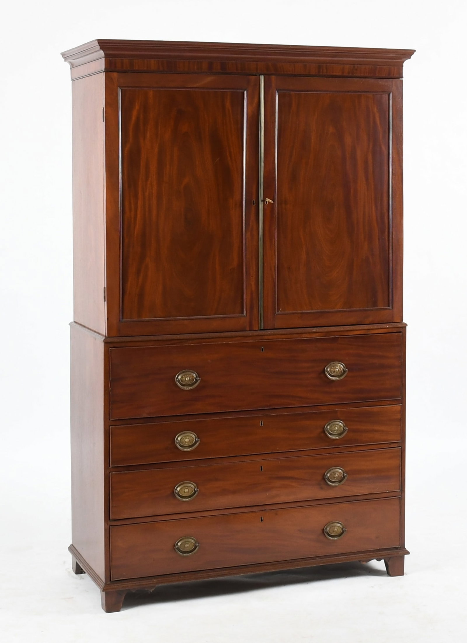 George III Mahogany Secretary Bookcase, Early 19th Century: A George III Mahogany Secretary Bookcase, Early 19th Century The upper section with a removable molded cornice over a pair of paneled doors, enclosing an a shelved interior with adjustable pigeon hole