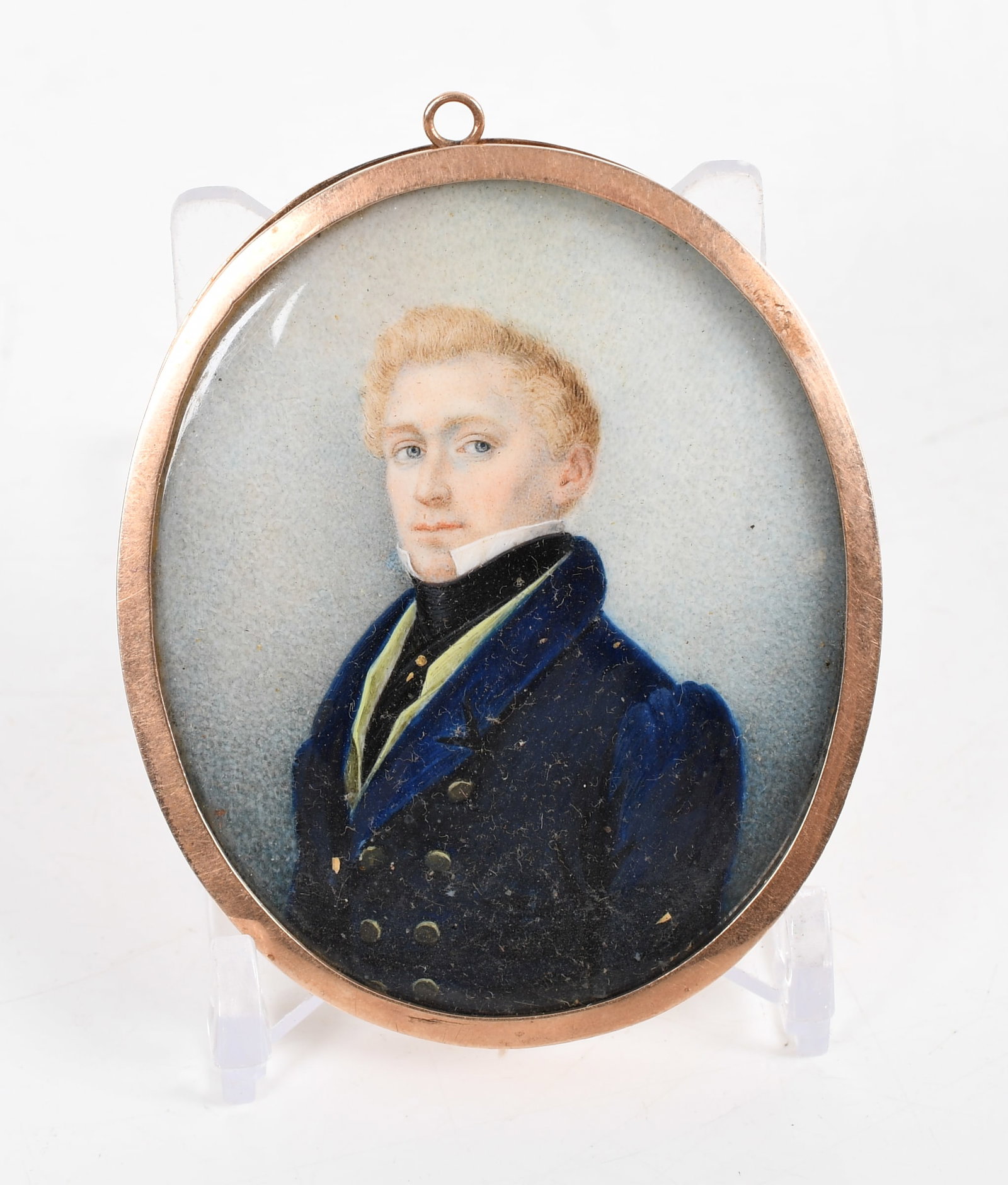 Portrait Miniature of a Gentleman, Probably English, 19th Century: A Portrait Miniature of a Gentleman, Probably English, First Quarter 19th Century Watercolor, unsigned. Depicting a blue-eyed young man with blonde hair, attired in a deep blue coat with tied black cr