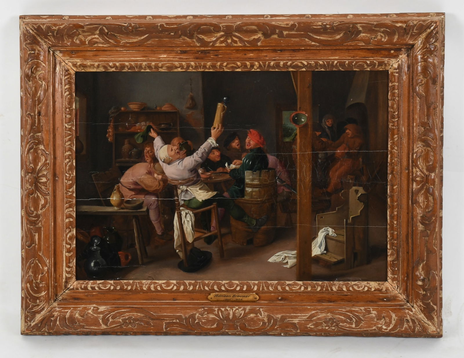 After Adriaen Brouwer (1605 - 1638) Oil on Panel: After Adriaen Brouwer (1605 - 1638) Oil on Panel A copy of the work, 'Peasants Carousing in a Tavern', in a carved wooden frame. Dimensions: 12 1/2in x 19in, the frame 20in x